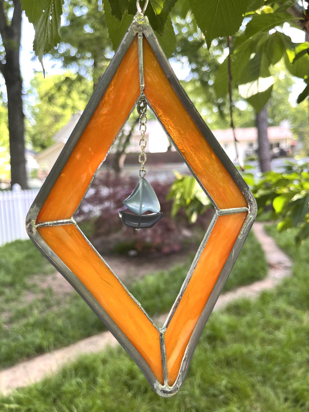 Orange diamond with boat