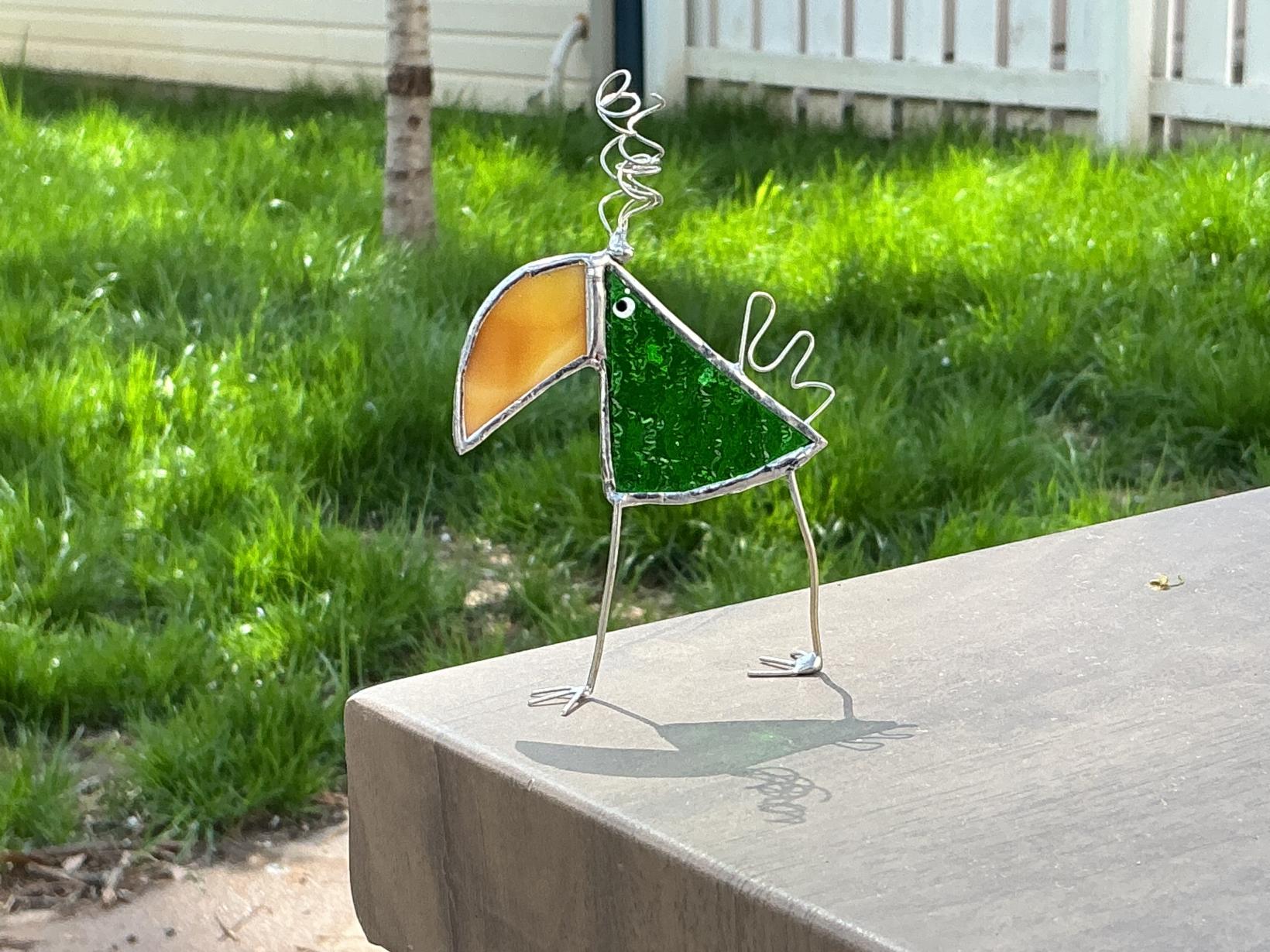 Green and brown silly bird