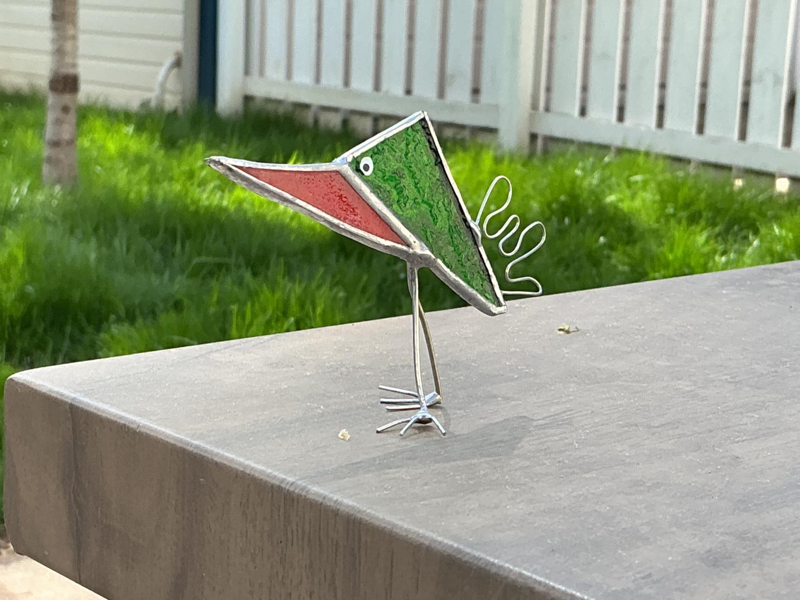 Green and red silly bird