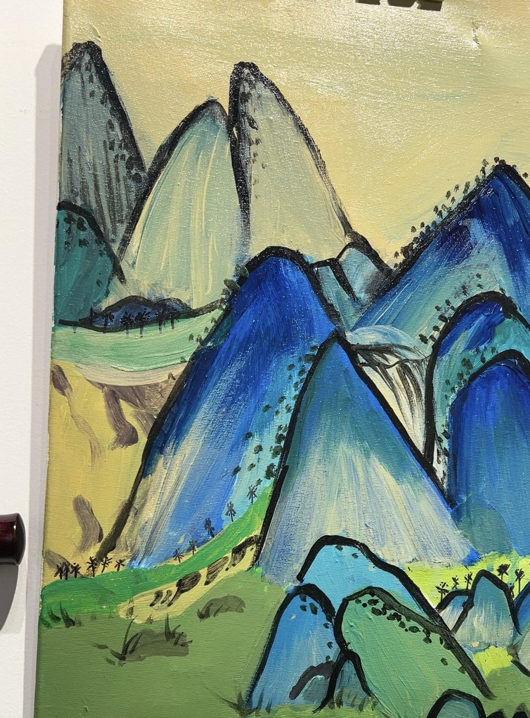 Green mountains and distant blue clouds